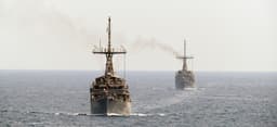 Which countries will send warships through the Strait of Hormuz by May 31?